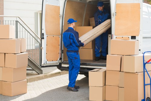 Removal van and movers handling an urgent local move in Merton