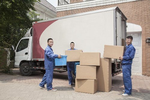 Person using an accessible website on a laptop for Man And A Van Merton