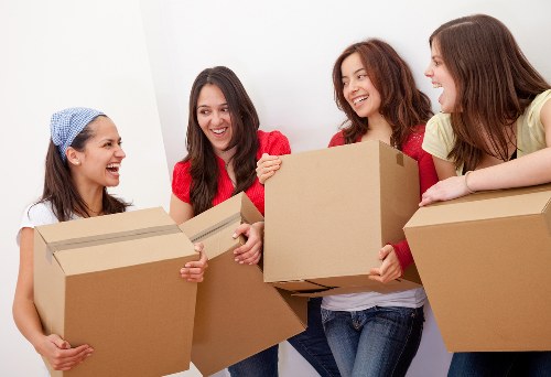 Professional furniture collection team handling bulky items in Merton