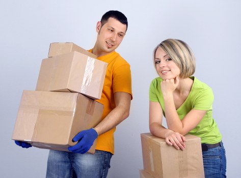 Packed office boxes and labeled materials ready for commercial moves in Merton