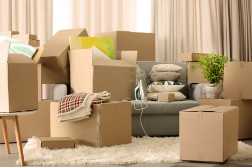 Removals crew handling household furniture in a Merton property with careful access planning