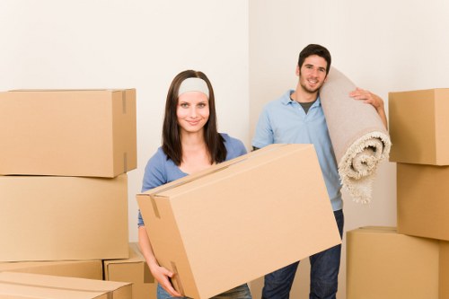 Professional team packing and labelling office items for a Merton office move