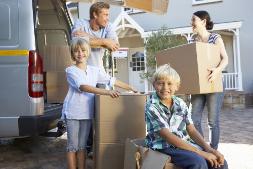 Professional furniture moving service in Merton preparing items for transport