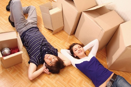 A worker using protective handling methods during loading